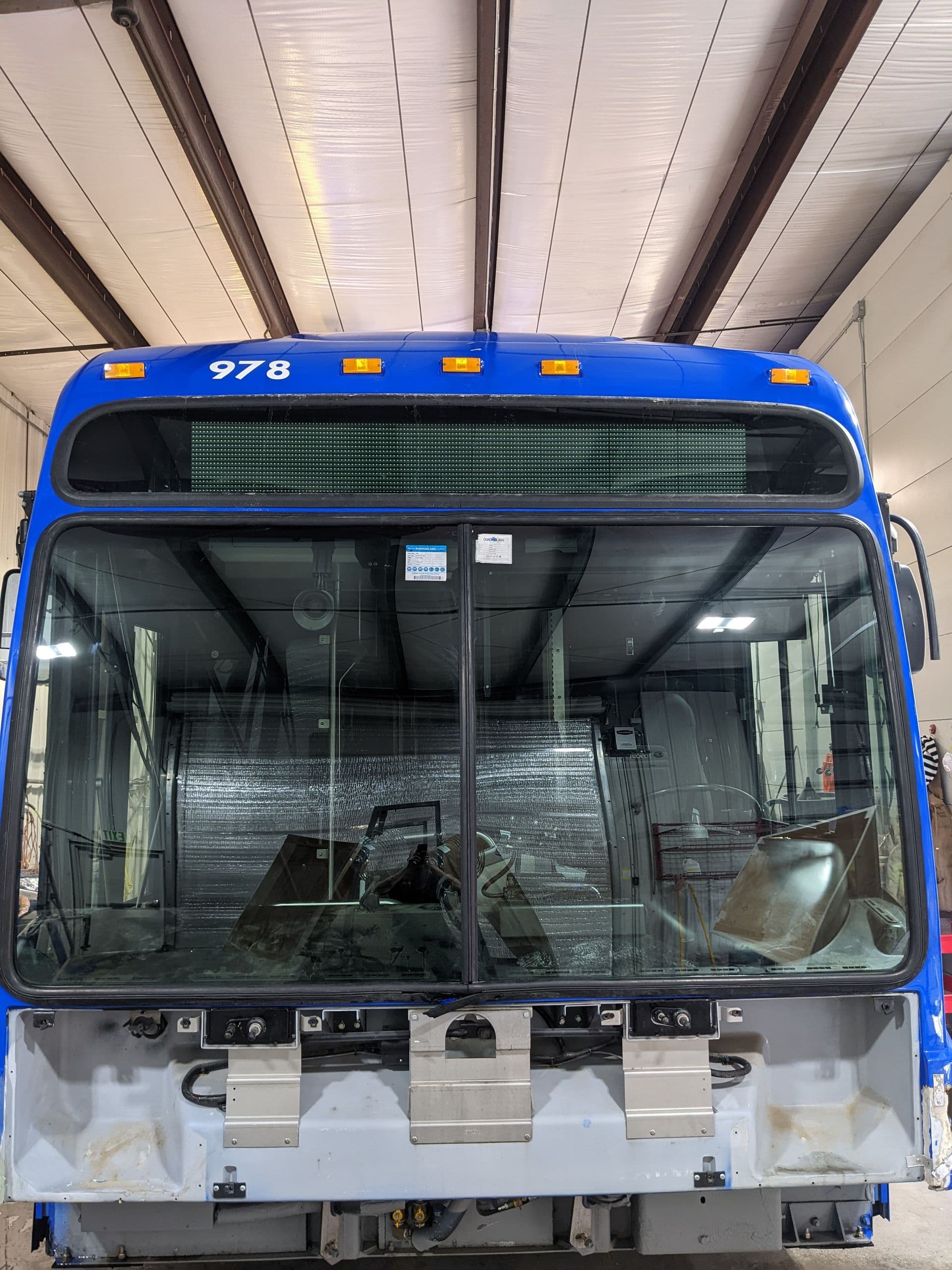 Transit bus with two newly installed windshields