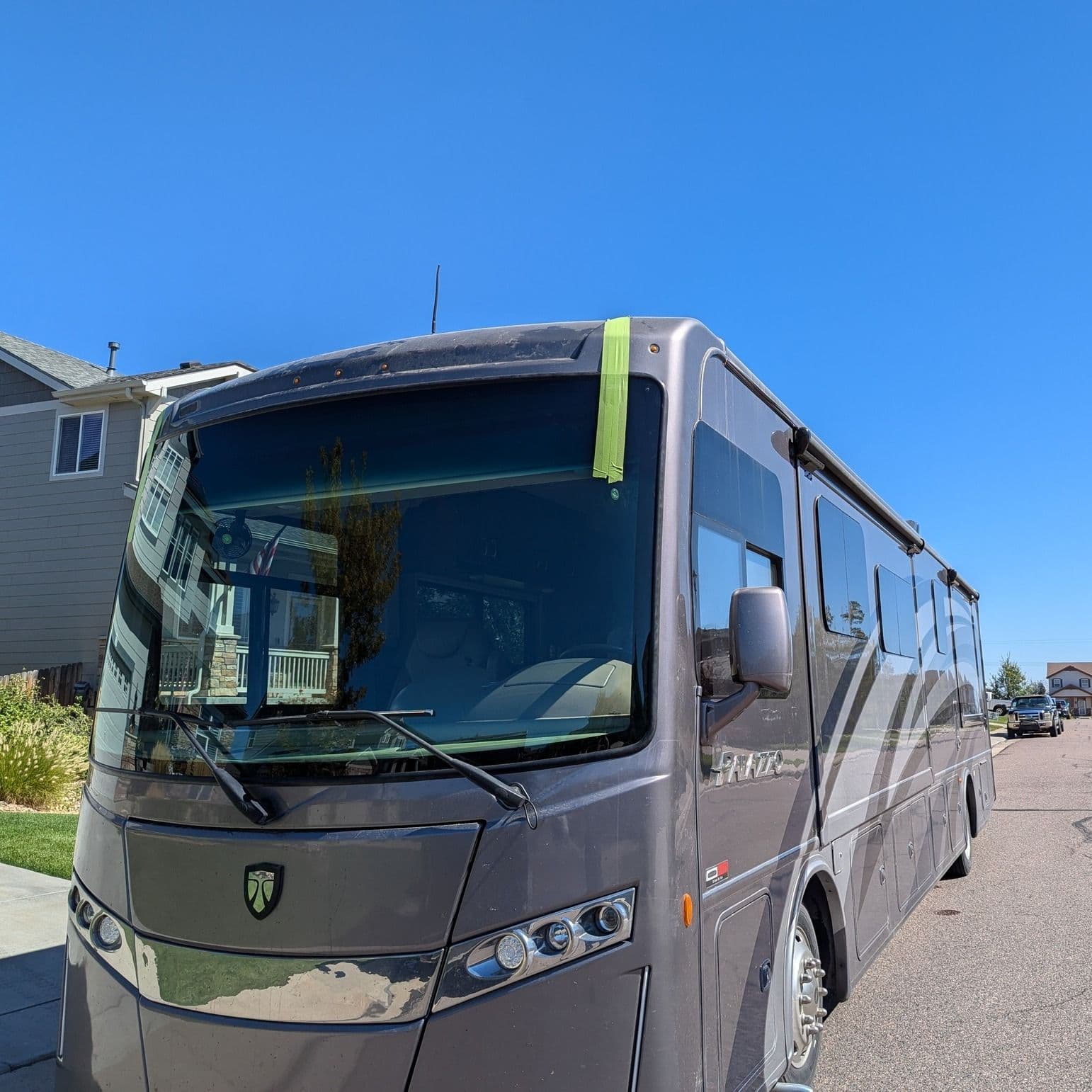 Thor Palazzo motorhome windshield replaced on a residential street